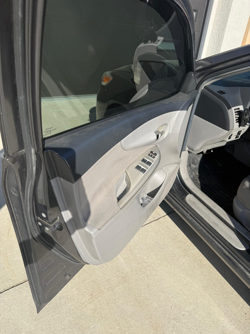 Toyota Corolla door panel before detailing