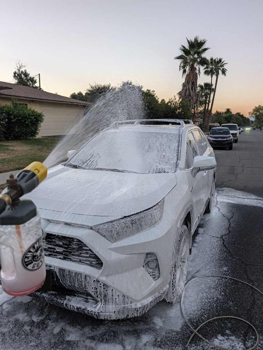 White Toyota RAV4 foam wash