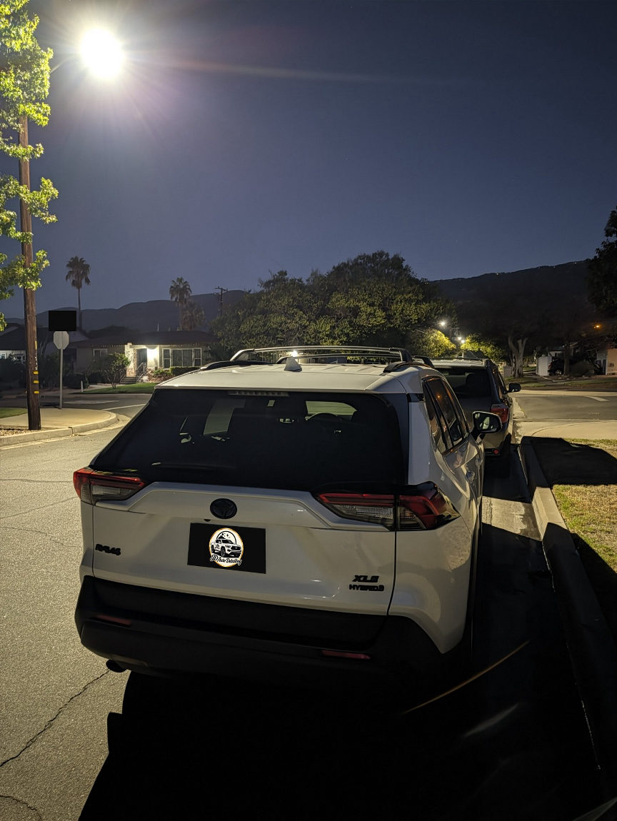 White Toyota RAV4 rear under the streetlight after detailing