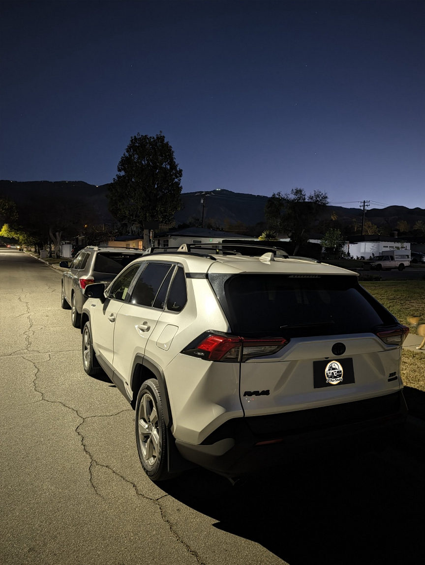 White Toyota RAV4 side at night after detailing