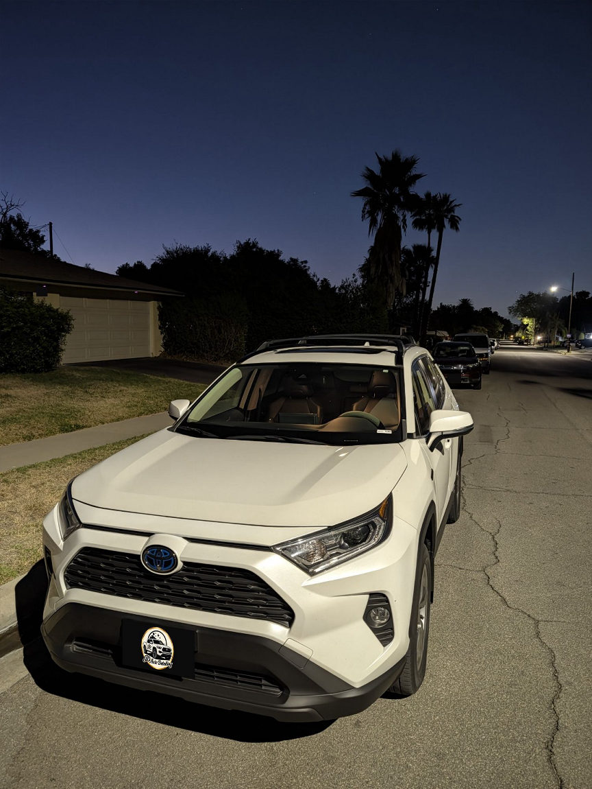 White Toyota RAV4 front at night after detailing