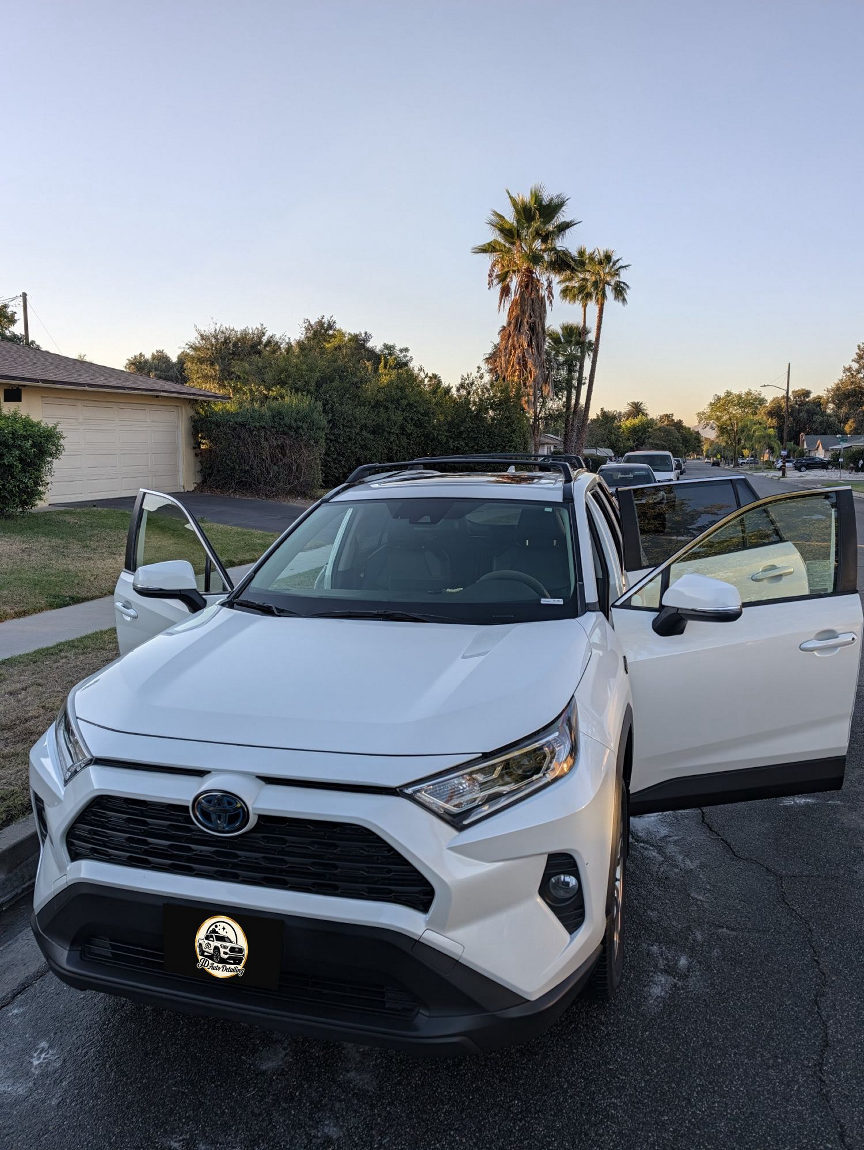 White Toyota RAV4 with doors open after detailing