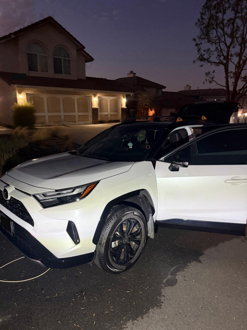 White Toyota RAV4 at dusk after detailing